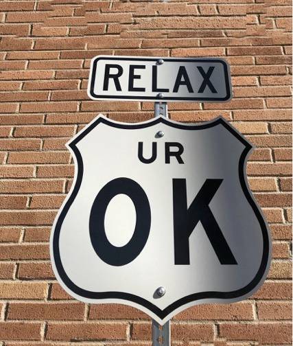 interstate sign displaying text 'relax, U R OK'